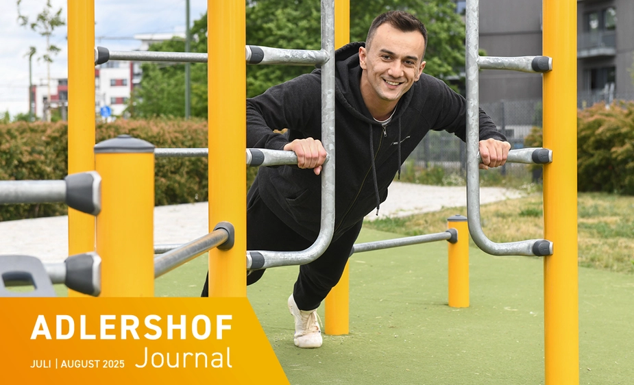 Faruk Garic does push-ups on the scaffolding outdoors