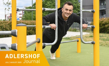 Faruk Garic does push-ups on the scaffolding outdoors