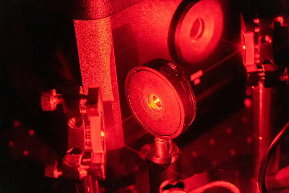 Installation illuminated in red light by a laser experiment