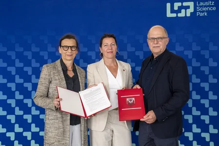 Three people with contracts