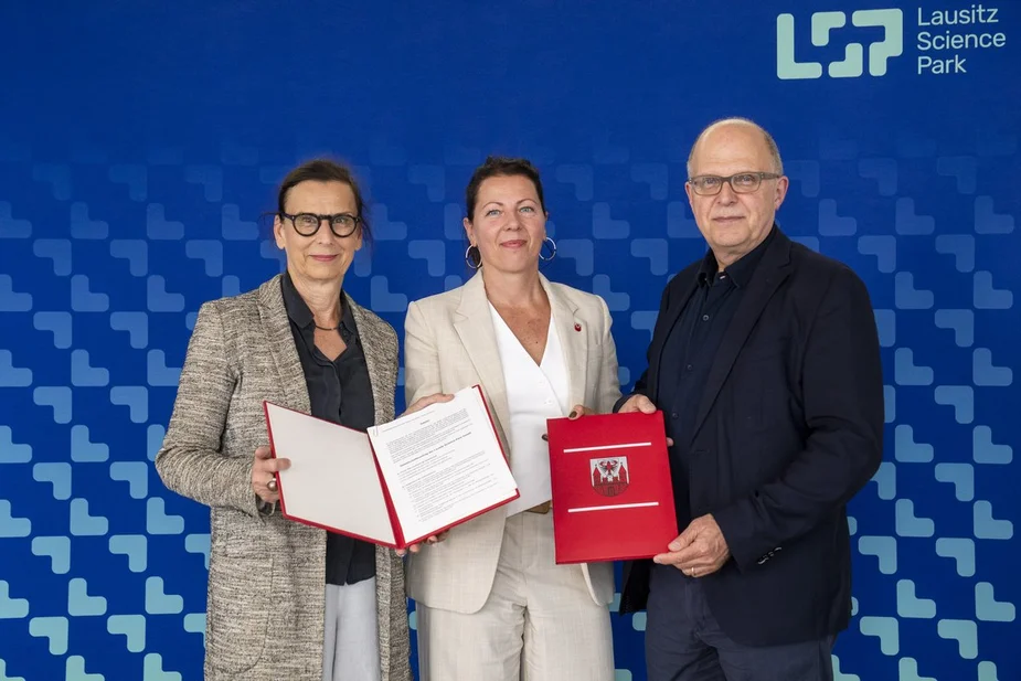 Three people with contracts