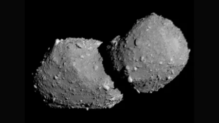 Close-up of an irregularly shaped, rocky asteroid